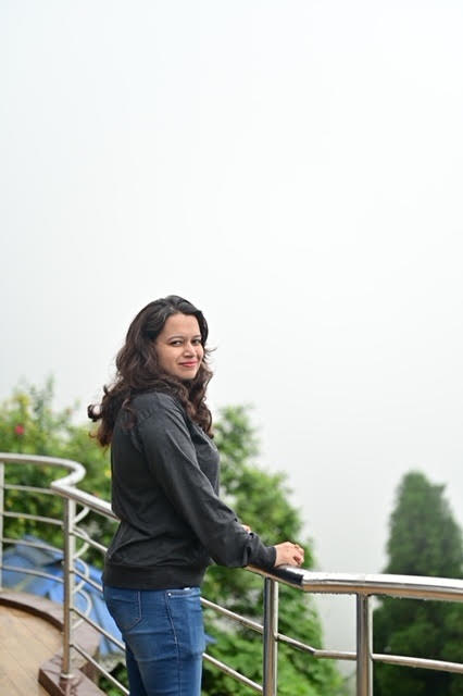 Illustrator Chandrani Das standing outdoors